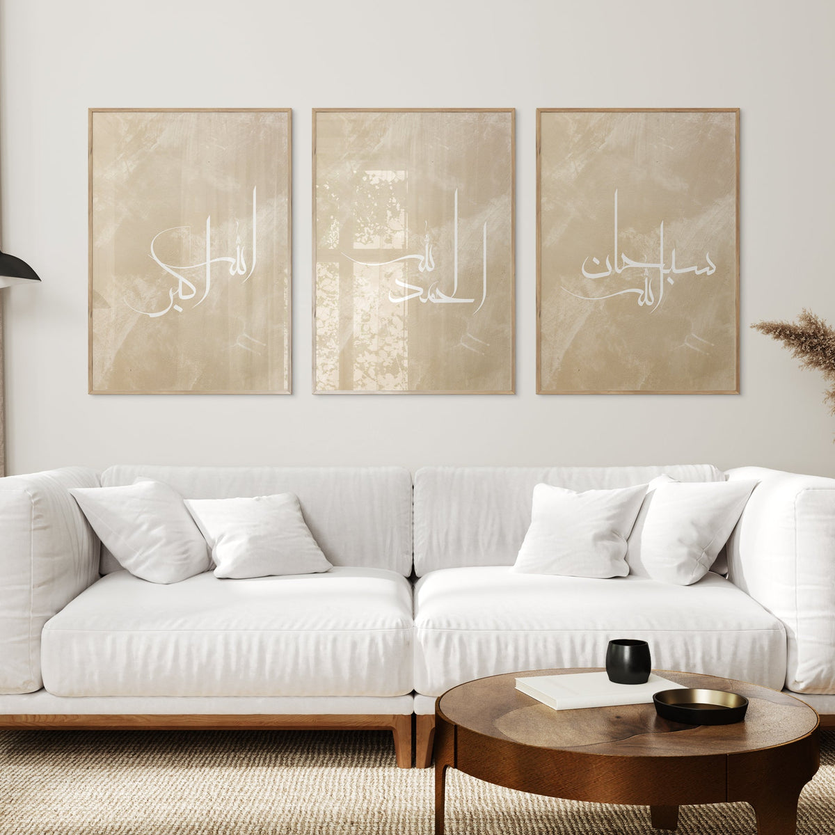 Modern living room with a white sofa, wooden coffee table, and decorative wall art.