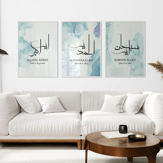 White sofa with decorative pillows in a living room setting, featuring three framed artworks on the wall.