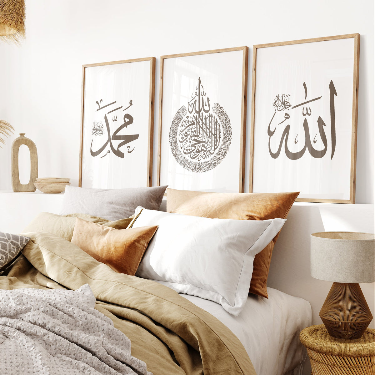 Bedroom with framed Arabic calligraphy on the wall, featuring a bed with pillows and a lamp.