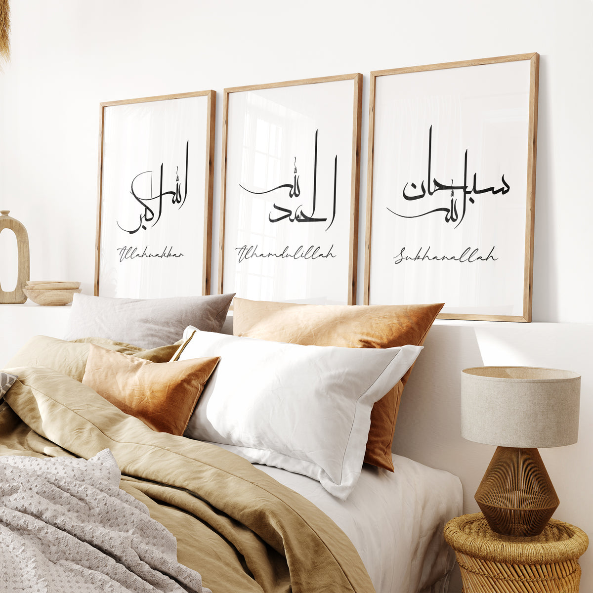 White Dhikr wall art set of three with Arabic calligraphy and transliterations displayed above a neutral bed.