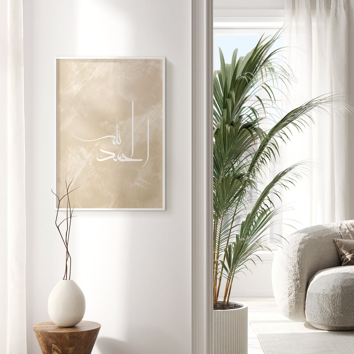 Modern interior with a framed artwork, plant, and white armchair.