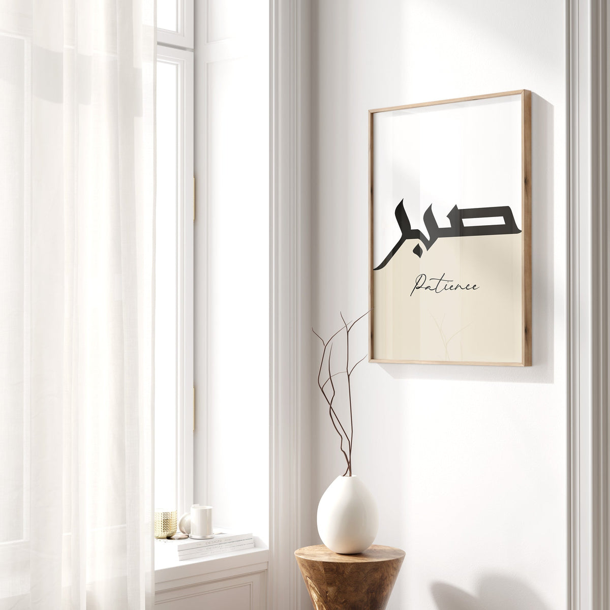 Framed artwork with text on a wall next to a window