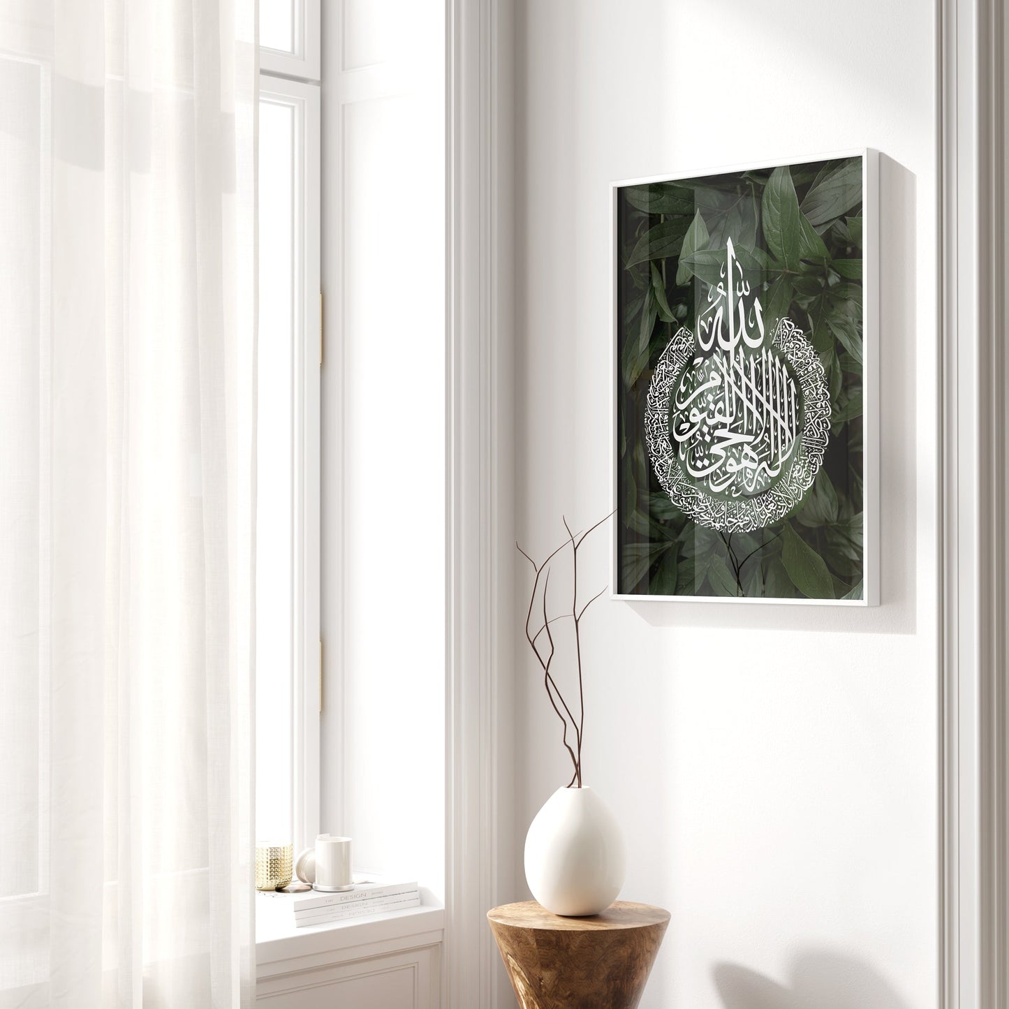 Framed artwork with Arabic calligraphy on a wall next to a window