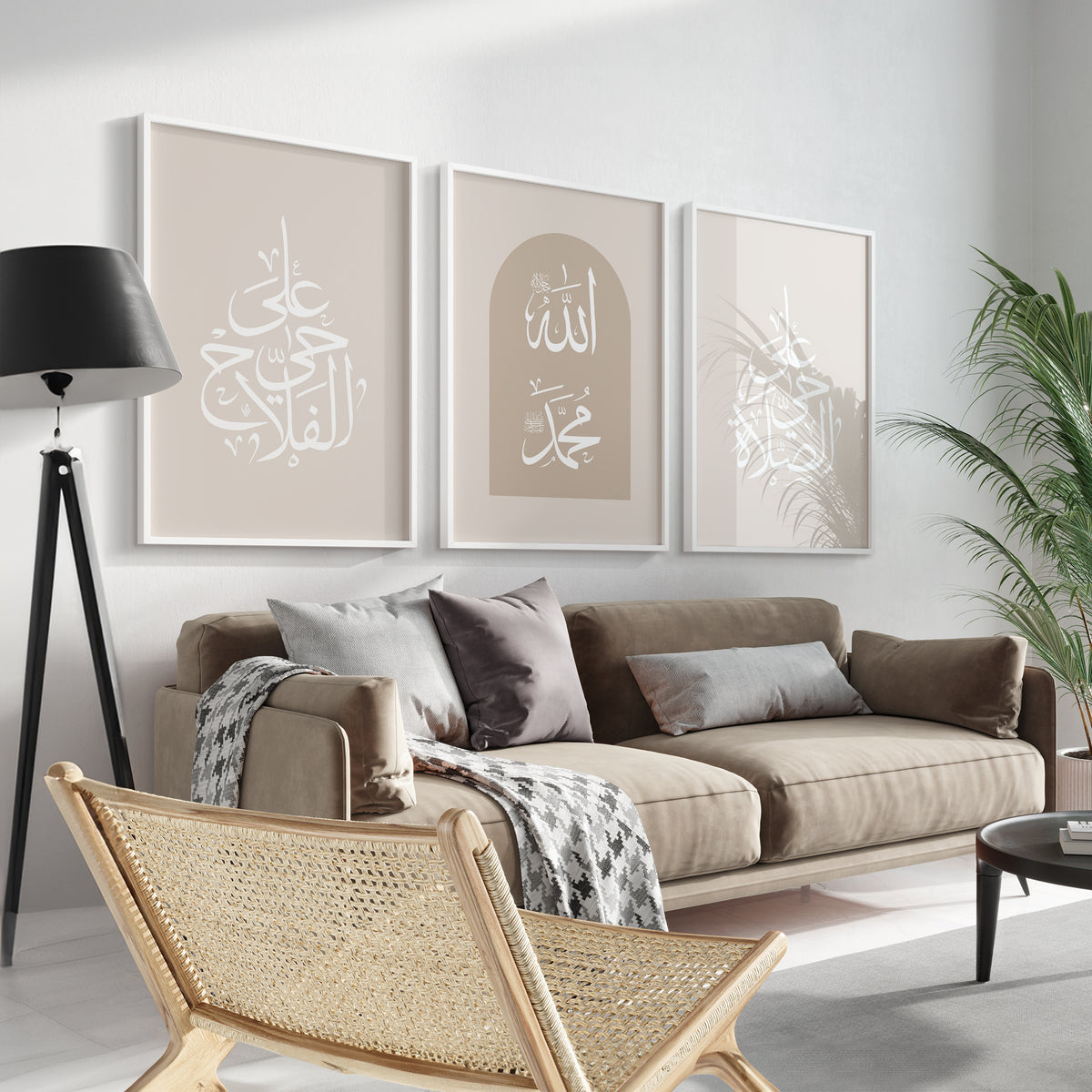 A set of three beige-framed Islamic wall art pieces is placed above a brown sofa with pillows, featuring Arabic calligraphy that reads "Hayya alasalah" and "Haya alal falah," which translates to "Come to prayer" and "Come to success," respectively, along with the names of Allah and Prophet Muhammad saw.