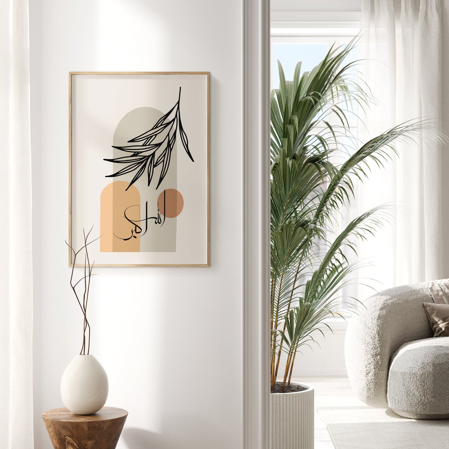 Modern interior with framed artwork, plant, and chair.