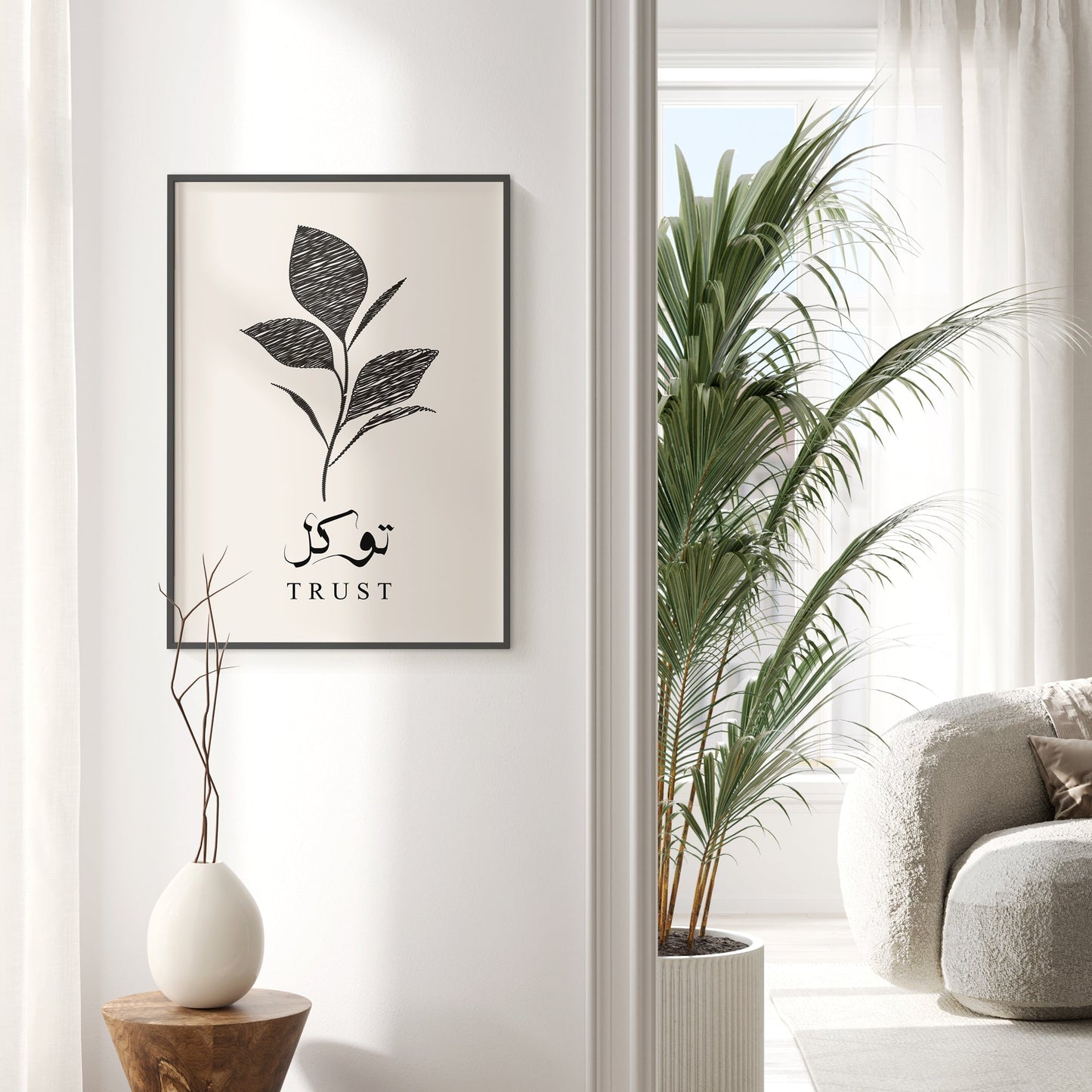 Framed artwork with plant design and 'TRUST' text in a modern living room.