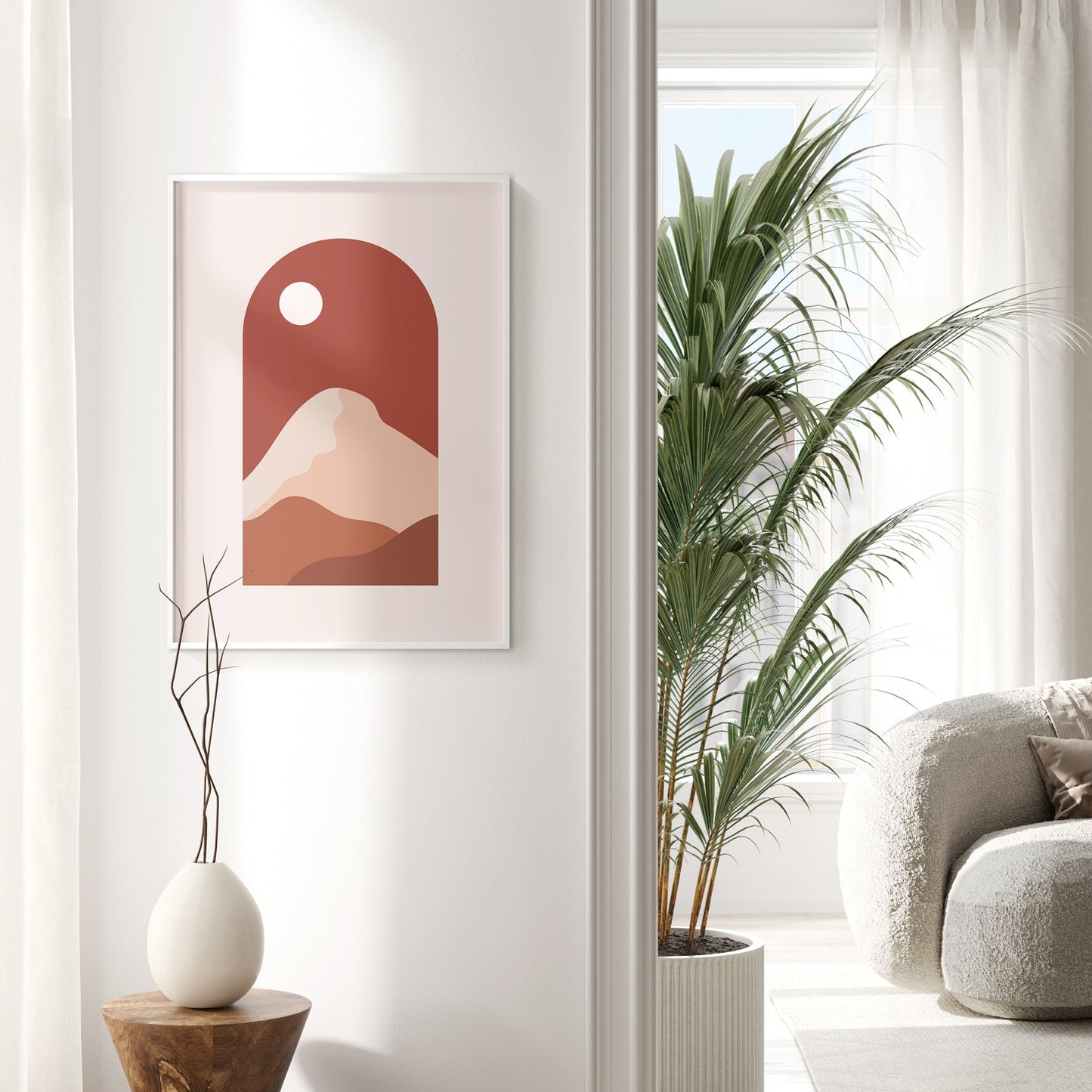 A set of three framed Islamic wall art prints featuring maroon landscapes with Arabic calligraphy, displayed on a white wall with green plants.