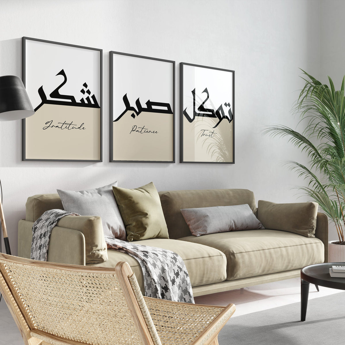 Living room with beige sofa, decorative pillows, and wall art with Arabic text and English translations.