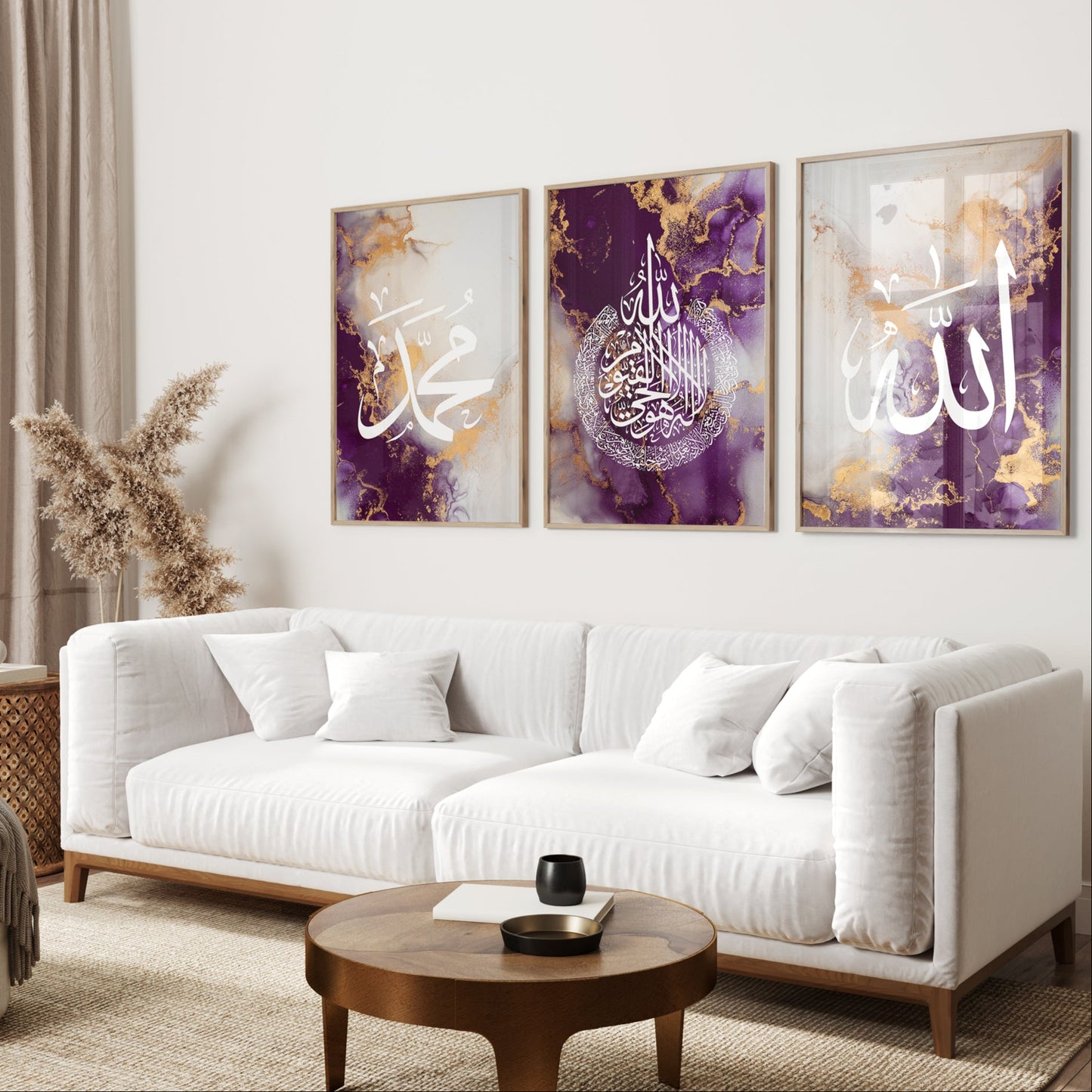 Living room with a white sofa, wooden coffee table, and three framed artworks on the wall.