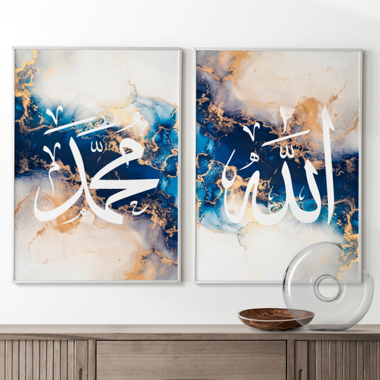 Two abstract art pieces with calligraphy on a wall above a wooden cabinet.