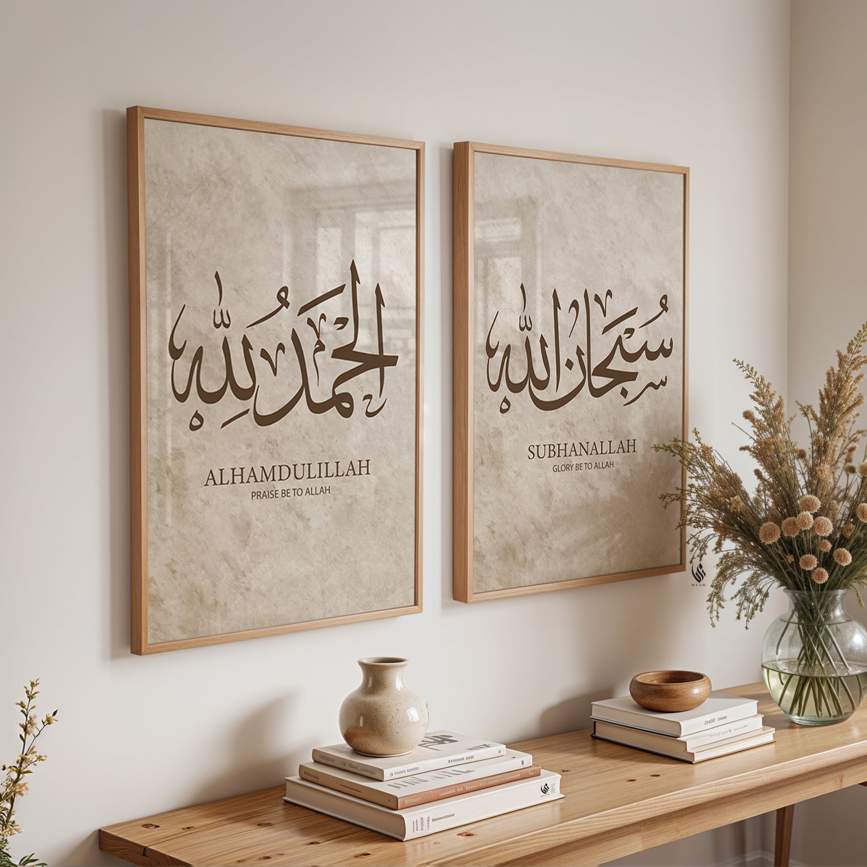 Two framed pieces of calligraphy art on a wall with a wooden console table below.