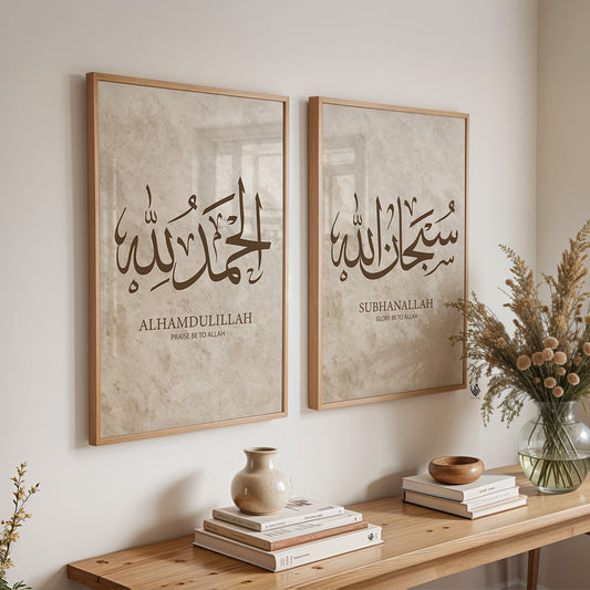 Two framed pieces of calligraphy art on a wall with a wooden console table below.