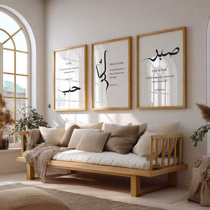 Wooden sofa with cushions in a room with framed artwork on the wall.