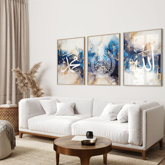 Living room with a white sofa, coffee table, and three abstract art pieces on the wall.