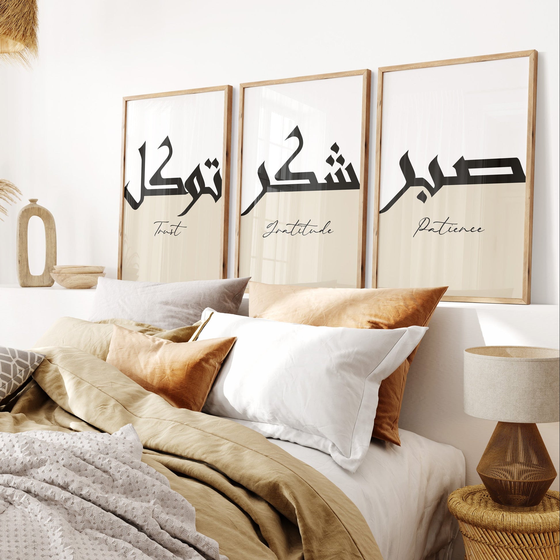Bedroom with framed artwork displaying Arabic calligraphy on a wall.
