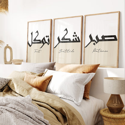 Bedroom with framed artwork displaying Arabic calligraphy on a wall.