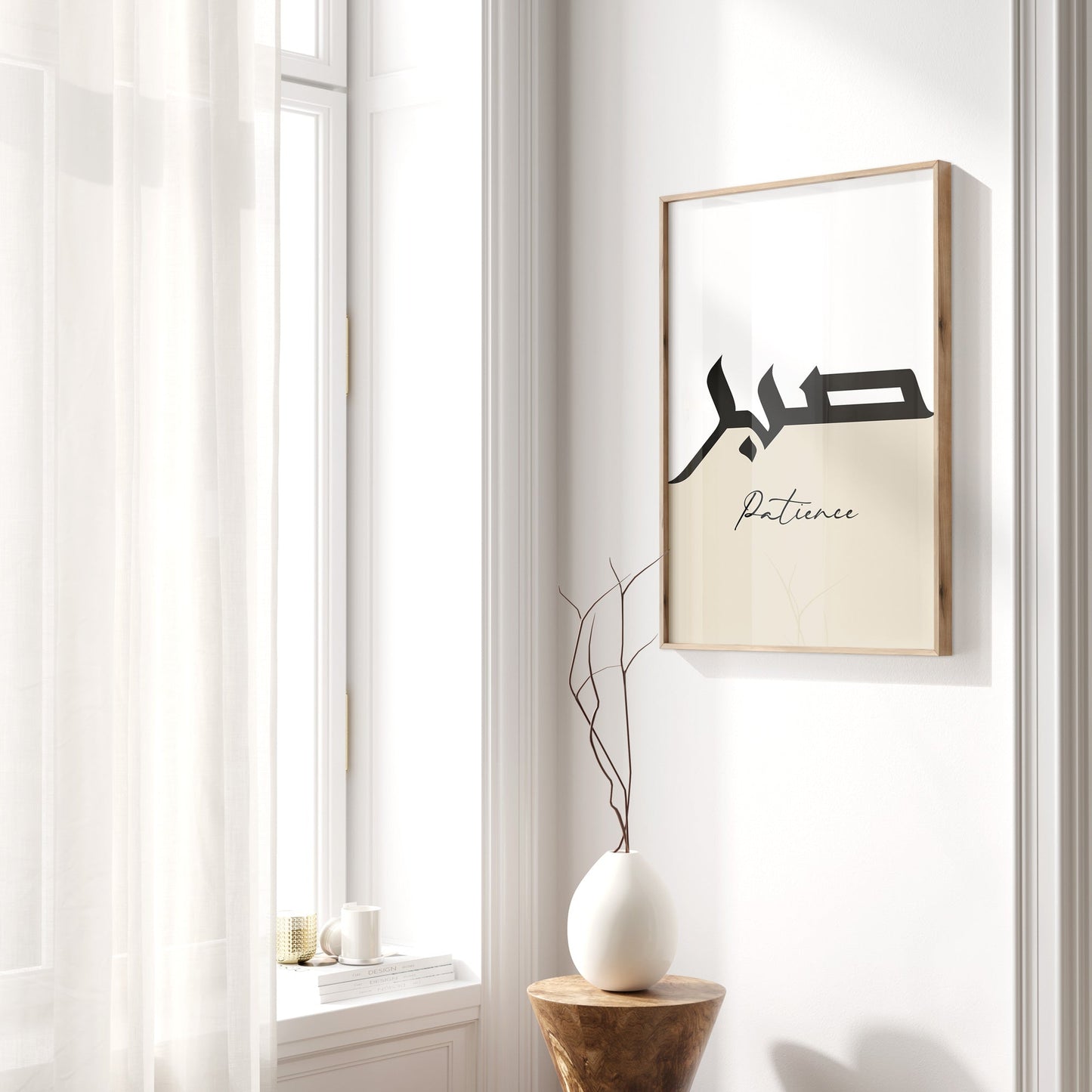 Framed artwork with text on a wall next to a window