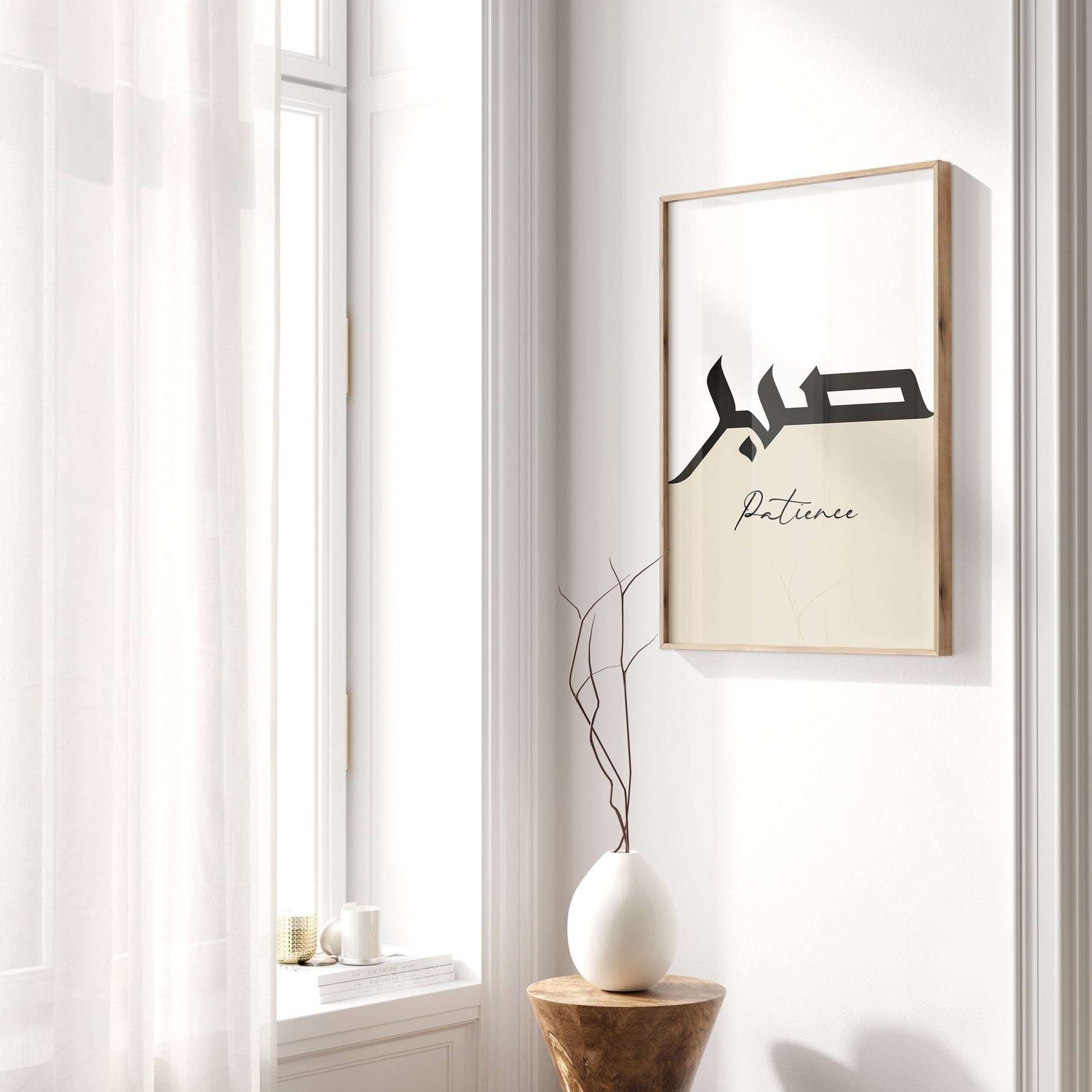 Framed artwork with text on a wall next to a window
