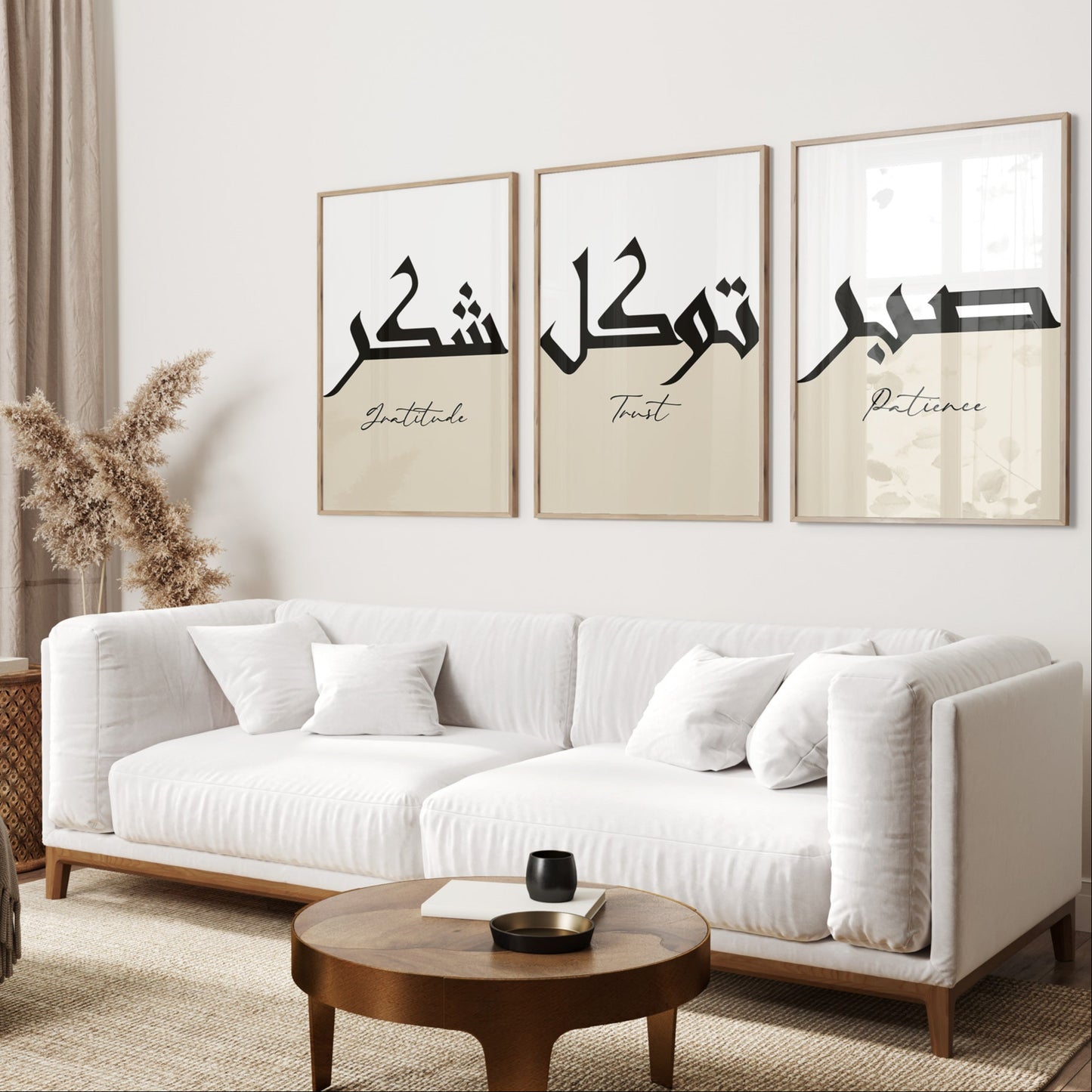Living room with a white sofa, wooden coffee table, and wall art with Arabic text.