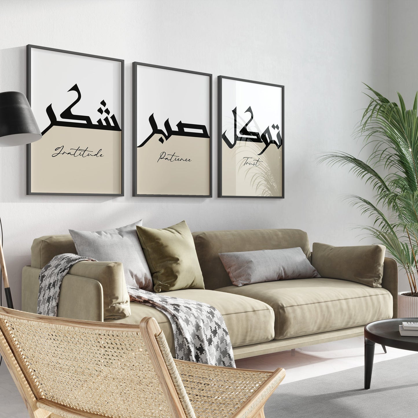 Living room with beige sofa, decorative pillows, and wall art with Arabic text and English translations.