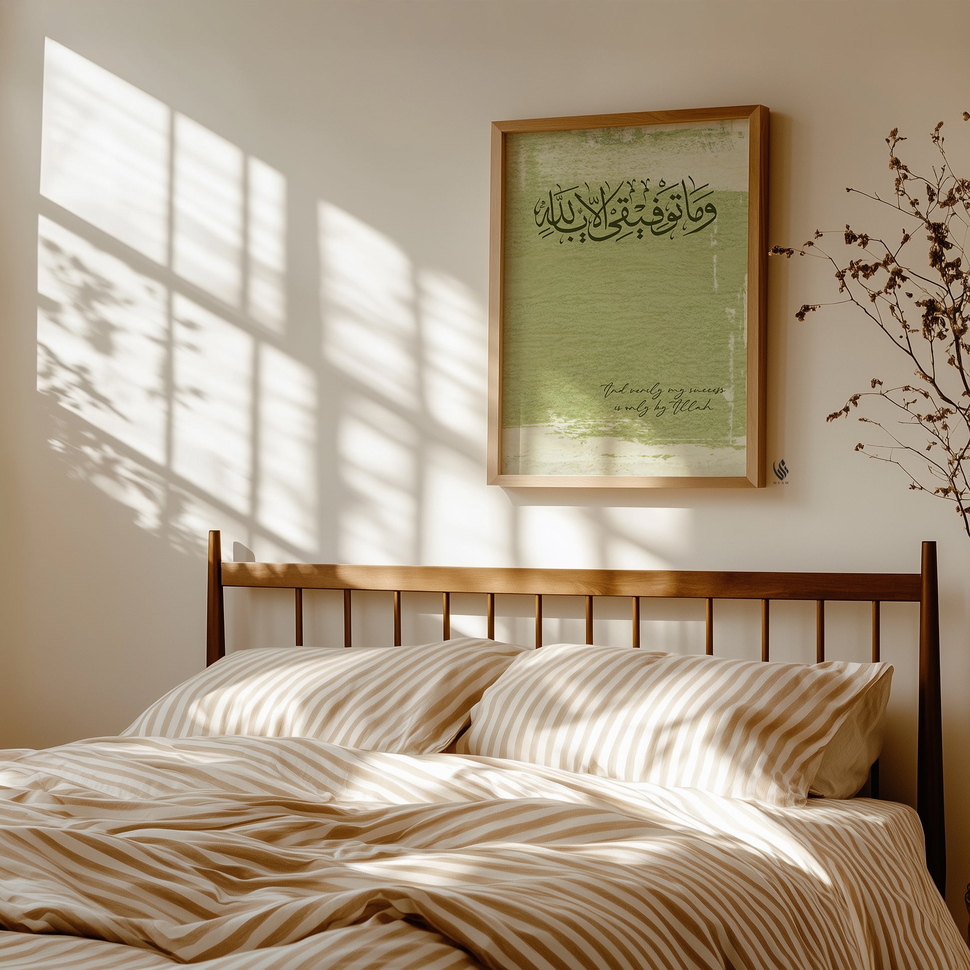 Bedroom with wooden bed, striped bedding, and framed artwork on the wall.