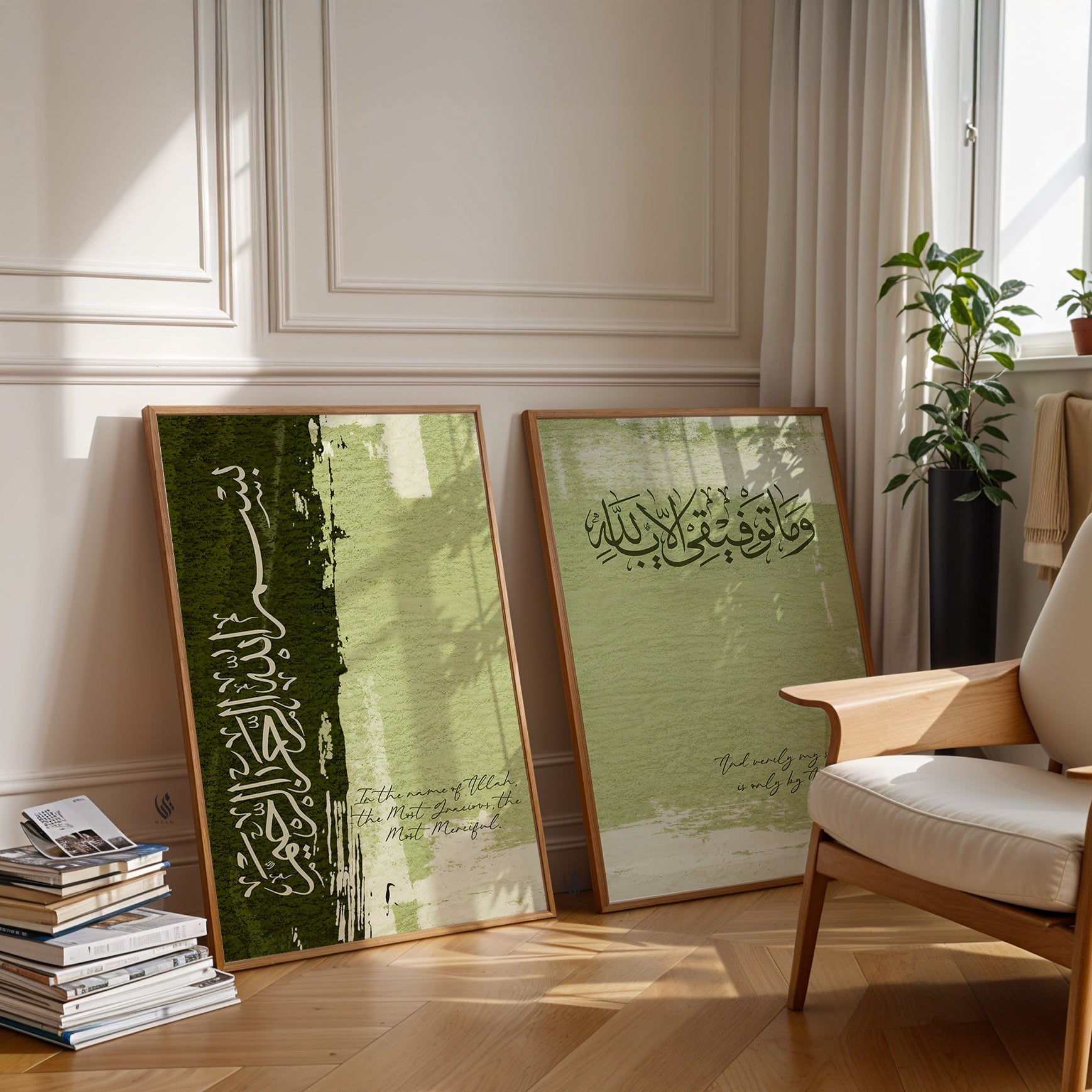Two framed artworks with Arabic calligraphy on a wall in a room with a chair and books.