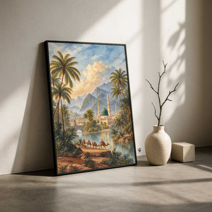 A framed landscape art print leaning against a wall on a concrete floor, next to a ceramic vase with a bare branch and a small block. The artwork depicts a tropical oasis with palm trees, mountains, a mosque, camels, and a river under a blue sky.
