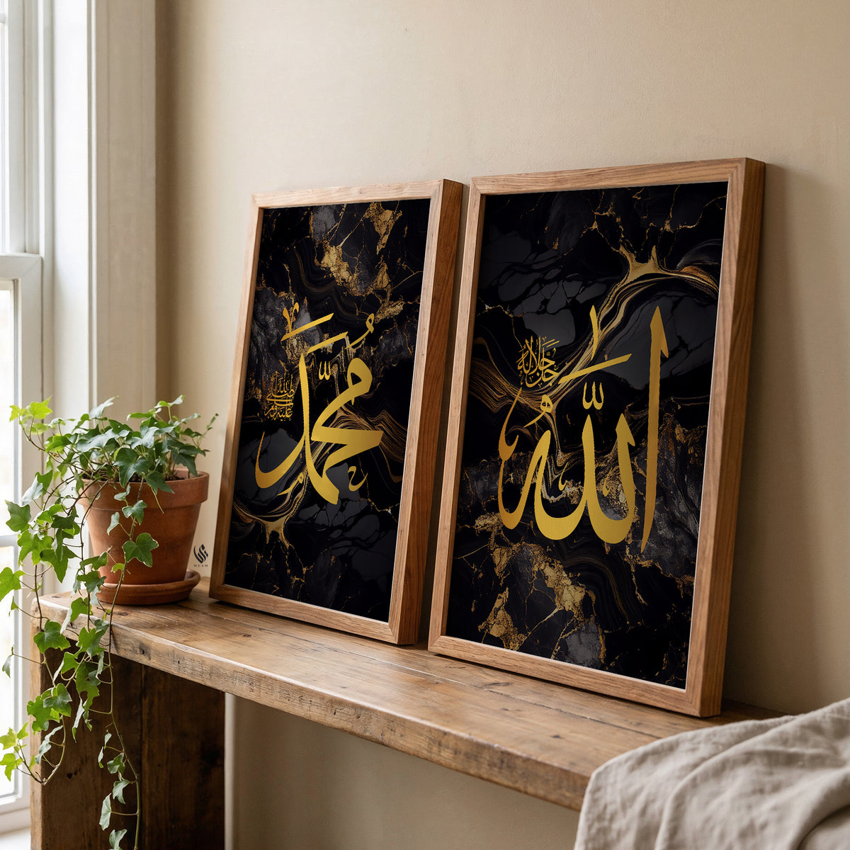 Allah and Muhammad Islamic wall art set of 2 in wood frames above a console table, featuring black marble artwork with rich gold Arabic calligraphy.