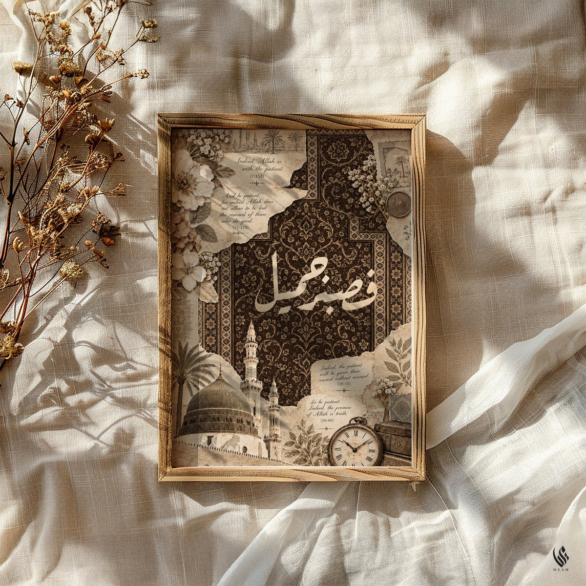 Flat lay of the Madina sabr print in a wooden frame on textured linen with dried flowers and natural sunlight.