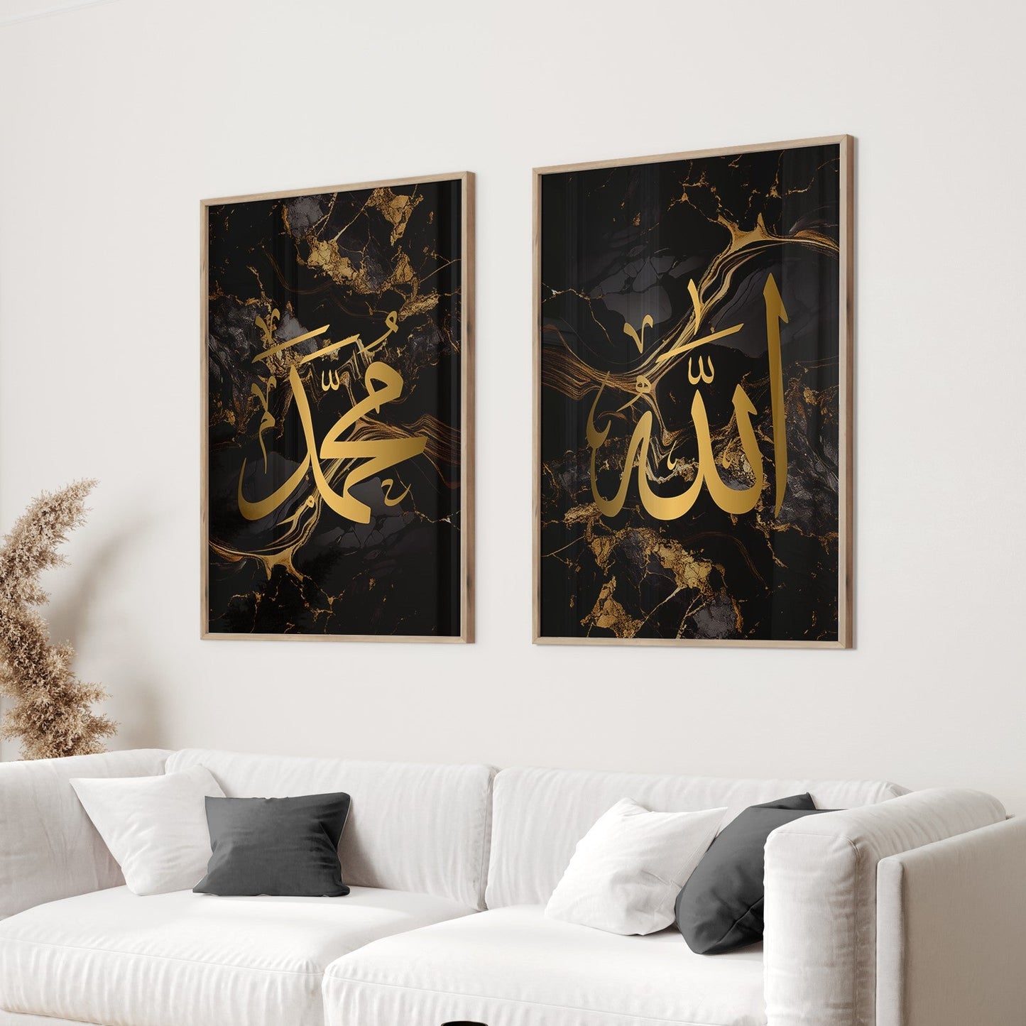 Two Black & Gold Arabic Calligraphy Islamic wall art prints with Allah and Muhammad in Arabic calligraphy thuluth in gold on top of a white sofa in a living room.